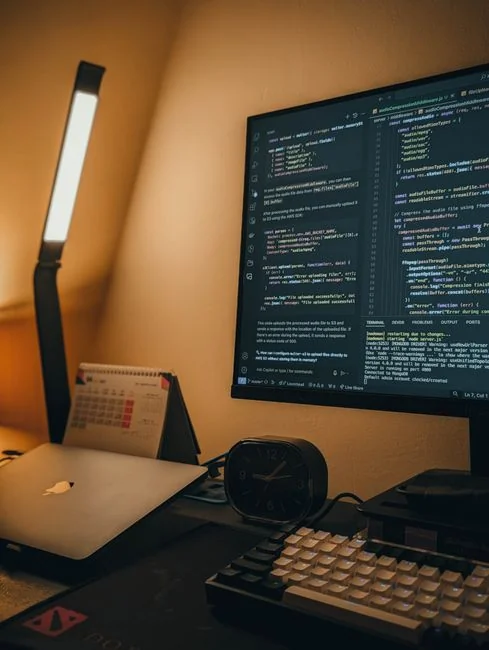 Businesswoman working on laptop with Android 6.0 Marshmallow webpage open.
